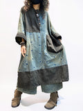 Oversized denim dress styled with boots